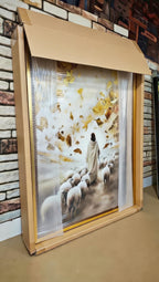 a framed painting of a shepherd tending to his flock, with a brick wall in the background.