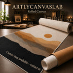 a rolled canvas with a landscape design, including mountains and a sun, on a table. The text "Artyly Canvas Lab Rolled Canvas" is displayed above the canvas, and "Custom sizes available - contact us" is written on the rolled-up canvas.